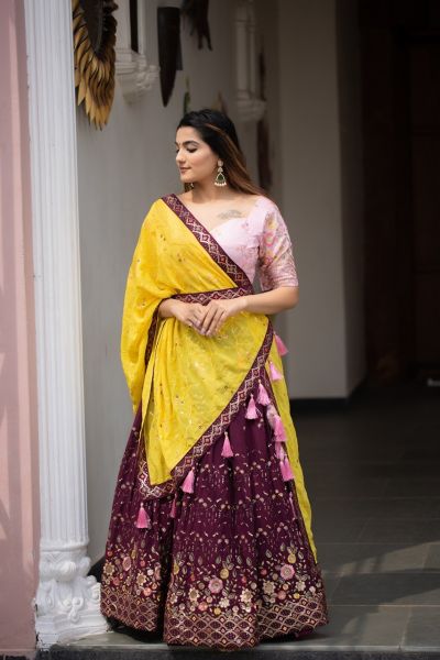 Lehenga choli The carnation wine with the intricate sequins work gives this lehenga a neat finish.